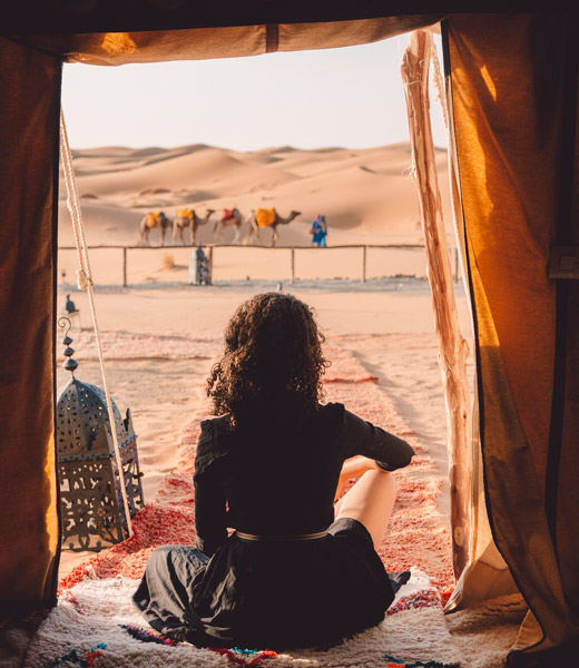 A woman at the entrance to a tent in the Sahara Desert